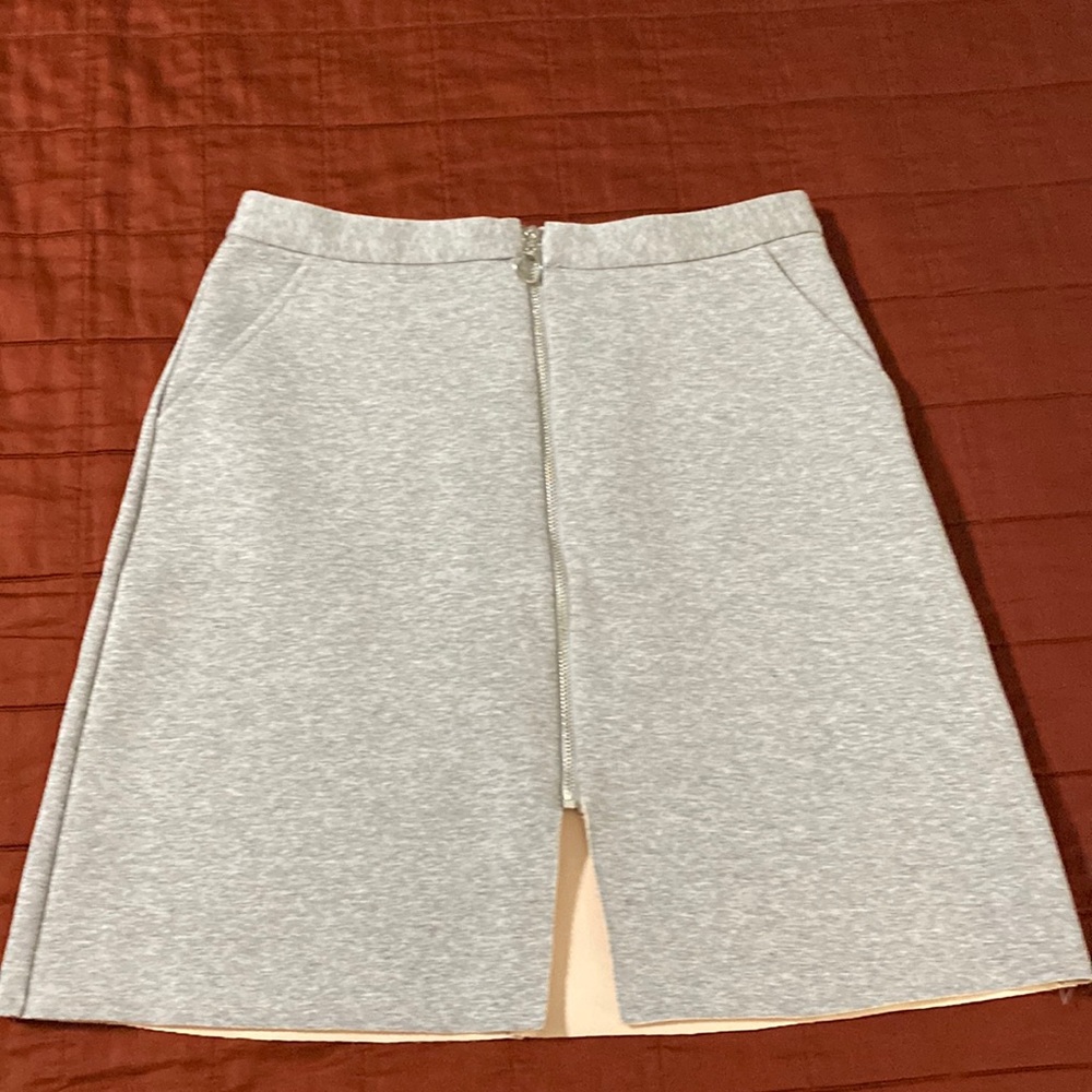 Top shop stretchy zip-up skirt.  Gray with full front zipper and pockets.